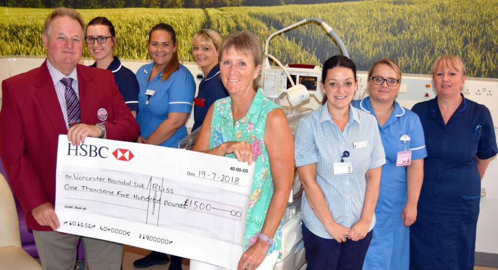 Neonatal clinical team being presented with a cheque for £1,500 from fundraising efforts.
