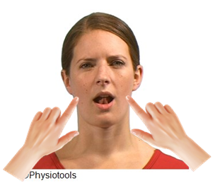 An image of an individual shown from the front their mouth is open and their tongue is touching the roof of their mouth. One finger is on each jaw joint