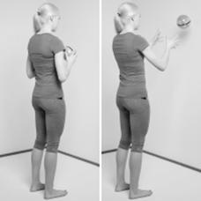 A picture of a person throw a ball against the wall and catch it