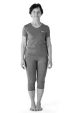 A picture of a person in a standing position with feet together
