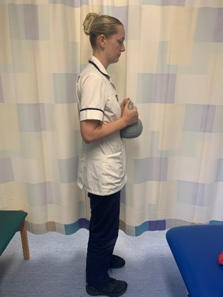 A picture of a person holding a weight in the hands
